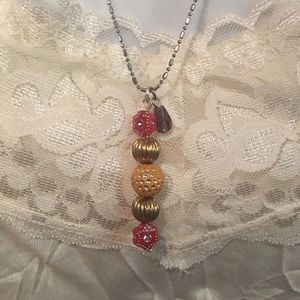 Orange , red & Gold pendant on silver chain